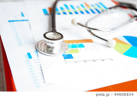 Stethoscope and US dollar banknotes on chart or graph paper, Financial, account, statistics and business data  medical health concept. 94606834