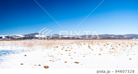Carpathian mountains, Ukraine. Wonderful snow-covered firs against the backdrop of mountain peaks. Panoramic view of the picturesque snowy winter landscape. Gorgeous and quiet sunny day. Carpathian mountains, Ukraine. Wonderful snow-covered firs against the backdrop of mountain peaks. Panoramic view of the picturesque snowy winter landscape. Gorgeous and quiet sunny day. 94607328