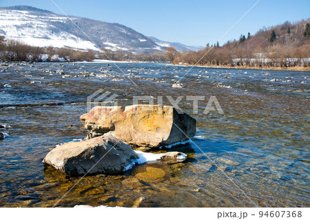 Beautiful landscape of the Carpathian Mountains National Park in Ukraine, with clear water of a wonderful river, blue sky as a copy space. Beautiful landscape of the Carpathian Mountains National Park in Ukraine, with clear water of a wonderful river, blue sky as a copy space. 94607368