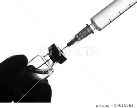 Doctor hand in gloves hold syringe and vaccine bottle on white background. Health and medical concept Doctor hand in gloves hold syringe and vaccine bottle on white background. Health and medical concept 94615662