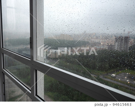 Rain drops on window. Rainy weather Rain drops on window. Rainy weather 94615663