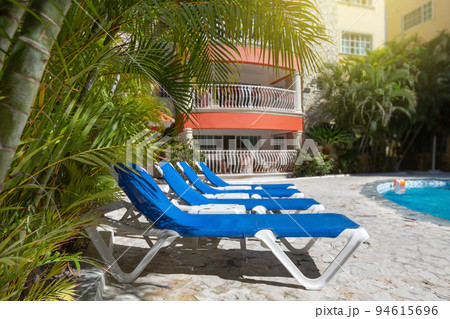 Backyard swim pool side Backyard swim pool side 94615696