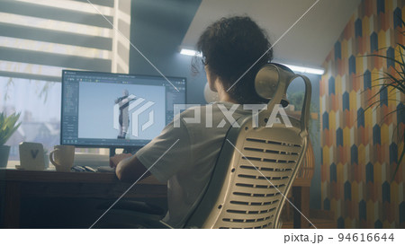 Guy making 3D animation for video game 94616644