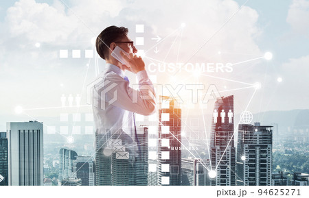 Concept of business success and control with confident boss against cityscape background Concept of business success and control with confident boss against cityscape background 94625271