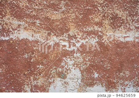 Brown peeled paint on old wall close up 94625659