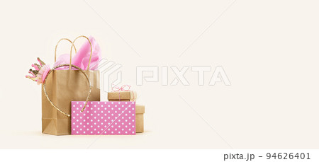 Gift or Sale concept. Shopping paper bag, Crown headband with pink tissue Gift or Sale concept. Shopping paper bag, Crown headband with pink tissue 94626401