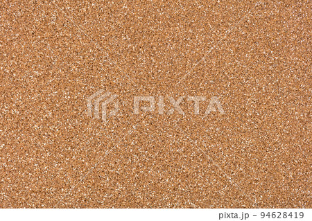 Light glitter background in new golden tone, texture for shiny design look. Elegant texture for Christmas design. Holiday abstract glitter with blinking lights. Christmas, Xmas pattern wallpaper. 94628419