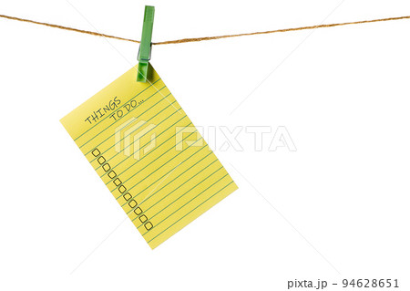 New Year New Goals. Yellow Sticky Note Paper on a clothesline isolated on white. To do list New Year New Goals. Yellow Sticky Note Paper on a clothesline isolated on white. To do list 94628651