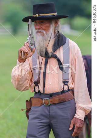 portrait of cowboy with a gun portrait of cowboy with a gun 94630078
