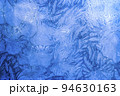 Abstract frosty pattern on glass, background texture on the window 94630163
