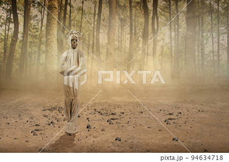 Pocong is covered with a white linen shroud standing Pocong is covered with a white linen shroud standing 94634718