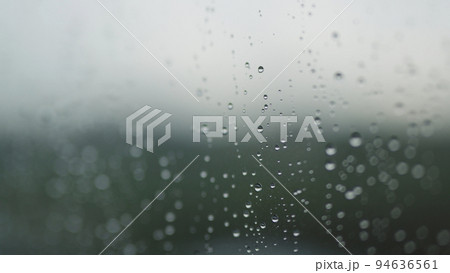 Real background of rain hitting glass with protective coating Real background of rain hitting glass with protective coating 94636561
