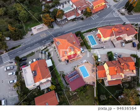 aerial drone view village at seaside with red roofs aerial drone view village at seaside with red roofs 94636564