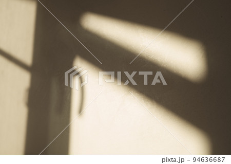 Abstract window frame shadow on plaster wall with natural light Abstract window frame shadow on plaster wall with natural light 94636687