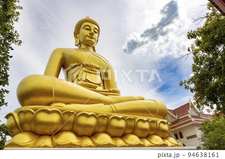 "Phra Buddha Dhammakaya Thep Mongkol" is a Big golden buddha statue made of copper, as tall as a 20-storey building (69 meters), located at Wat Paknam Bhasicharoen. Bangkok, Thailand on a sunny day 94638161