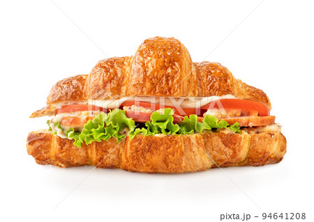 Croissant sandwich with ham, lettuce, tomatoes isolated on white background. Healthy and fast food. 94641208