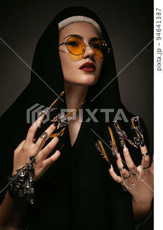 Beautiful woman with art makeup, creative long nails. Design manicure. Beauty face. 94641387