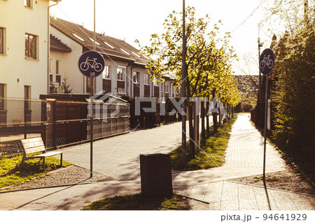 Empty Bike path in the city. Bicycle road next to houses. Empty Bicycle way for bike. Road sign. Recreation in open air concept in Pruszcz Gdanski Poland 94641929