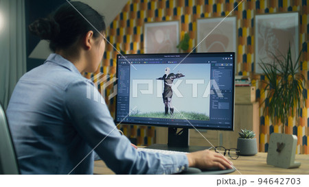 Woman making 3D animation for video game 94642703