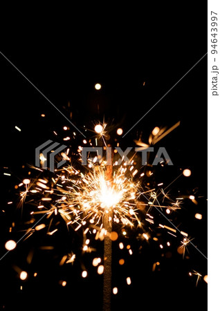 yellow sparkler with fire particles yellow sparkler with fire particles 94643997