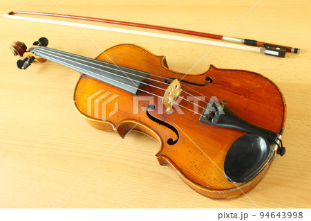 antique violin with a fiddlestick antique violin with a fiddlestick 94643998