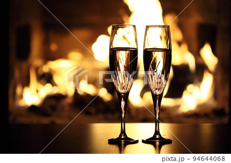 two glasses in front of fireplace two glasses in front of fireplace 94644068