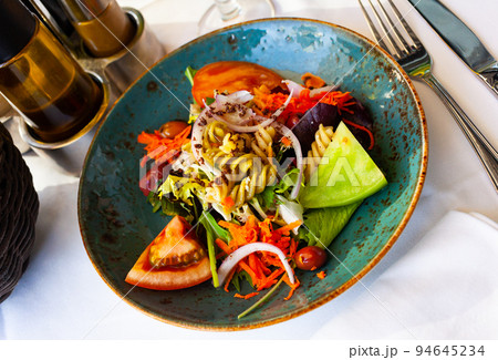 Appetizing salad with vegetables and pasta Appetizing salad with vegetables and pasta 94645234