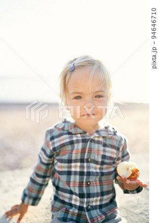 Little girl with an apple in her hand. Portrait. High quality photo 94646710