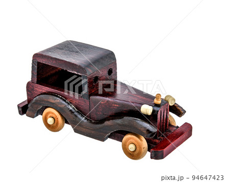 Brown Beige Natural Eco wooden car isolated. Well crafted, covered with stain and varnish, Vintage old toy model in rustic style for kids. Brown Beige Natural Eco wooden car isolated. Well crafted, covered with stain and varnish, Vintage old toy model in rustic style for kids. 94647423