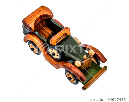 Brown Beige Natural Eco wooden car isolated. Well crafted, covered with stain and varnish, Vintage old toy model in rustic style for kids. 94647426
