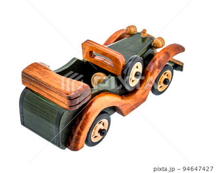 Brown Beige Natural Eco wooden car isolated. Well crafted, covered with stain and varnish, Vintage old toy model in rustic style for kids. 94647427