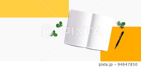 Blank notebook with shamrock leaves 94647850