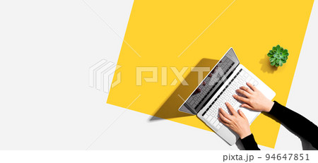 Person using a laptop computer 94647851