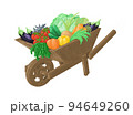 Garden wooden wheelbarrow with vegetables and herbs 94649260