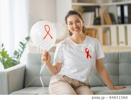 Smiling woman with red satin ribbon Smiling woman with red satin ribbon 94651560