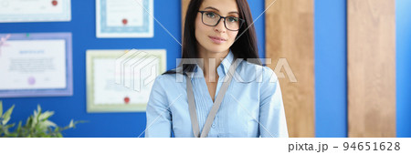 Beautiful businesswoman is standing in the office Beautiful businesswoman is standing in the office 94651628