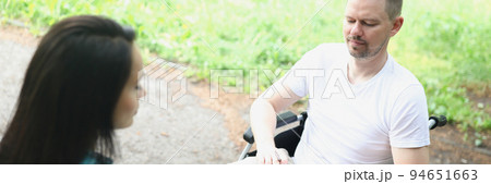A man in a wheelchair in makes notes A man in a wheelchair in makes notes 94651663