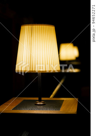 Row of the table lamps at a low light atmospheric restaurant. Selected focus and bokeh Row of the table lamps at a low light atmospheric restaurant. Selected focus and bokeh 94652271