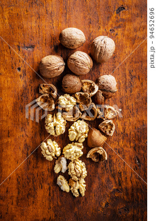 Peeled walnut on wooden table. Peeled walnut on wooden table. 94652696
