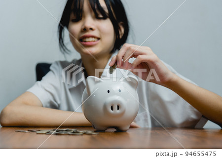 child asian finance economic investment wealth pig currency money business banking, cash success saving girl holding coin piggy bank. child asian finance economic investment wealth pig currency money business banking, cash success saving girl holding coin piggy bank. 94655475