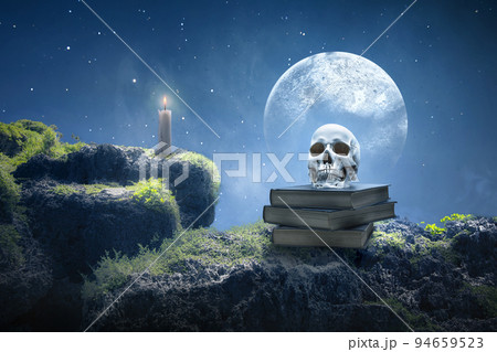 Pile of the book with a human head skull 94659523