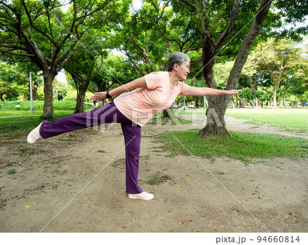 Portrait of 60s senior adult elderly asia woman smiling standing with towel after sport and enjoy with nature fresh air in the park. Portrait of 60s senior adult elderly asia woman smiling standing with towel after sport and enjoy with nature fresh air in the park. 94660814