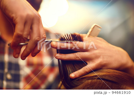 Time for a new hairdo. Handsome young bearded man came to the barber for a haircut. hipster style. Time for a new hairdo. Handsome young bearded man came to the barber for a haircut. hipster style. 94661910