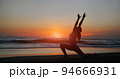 woman practice yoga on beach 94666931