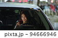 businesswoman use smartphone in car 94666946