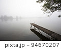 Jetty in the misty river Meuse 94670207