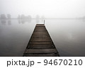 Jetty in the misty river Meuse 94670210