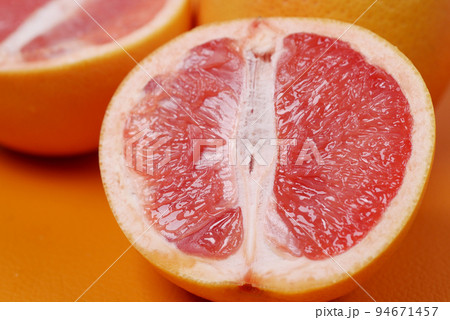 close up of slice of orange fruit on color background close up of slice of orange fruit on color background 94671457
