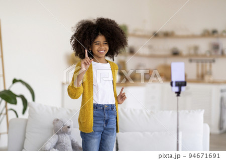 Funny african american teen girl streaming from home Funny african american teen girl streaming from home 94671691
