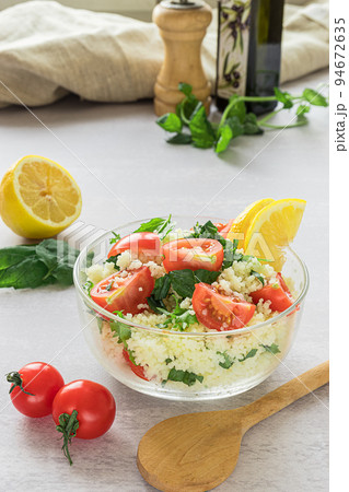 Fresh home-made tabouli, or tabbouleh salad, with its ingredients Fresh home-made tabouli, or tabbouleh salad, with its ingredients 94672635